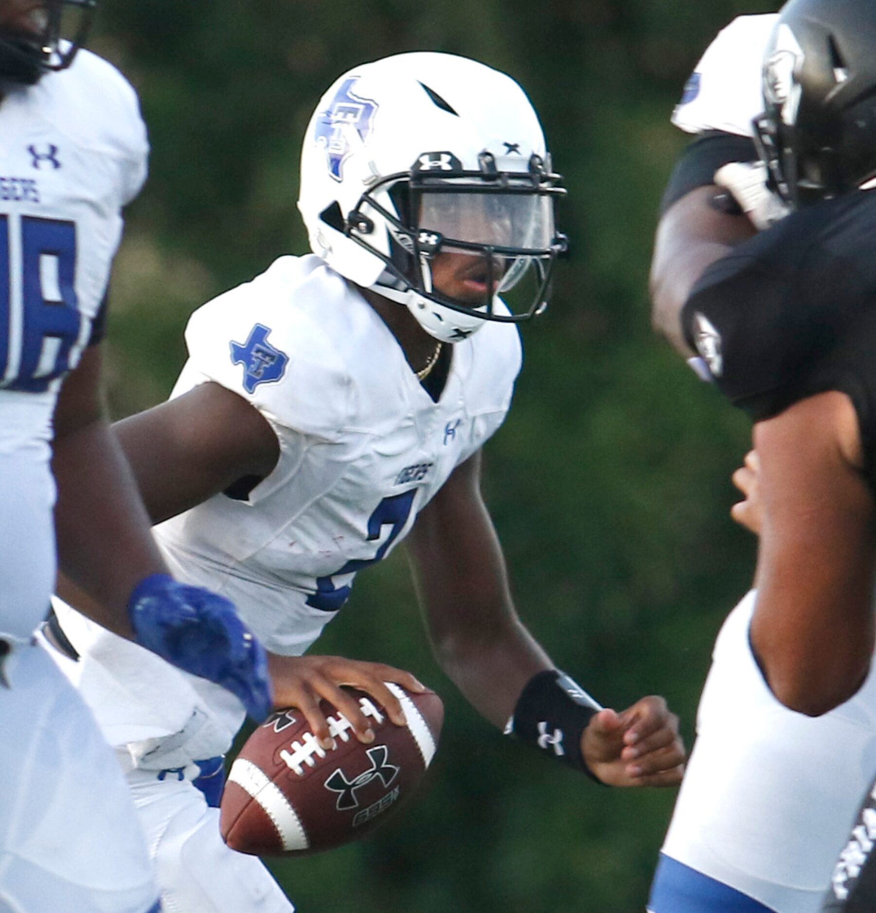 Trinity Christian-Cedar Hill quarterback Shedeur Sanders (2) eyes the defense as he...