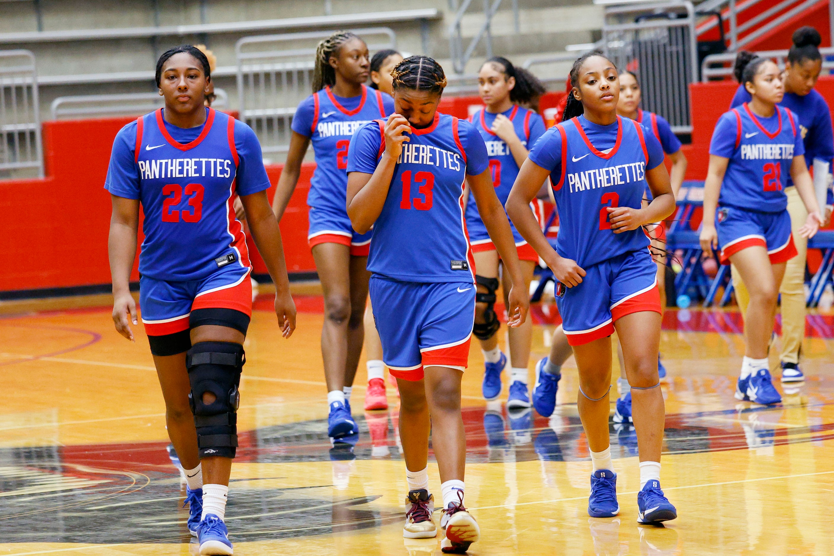 Duncanville players leave the court after their overtime loss against Pearland in Sandra...