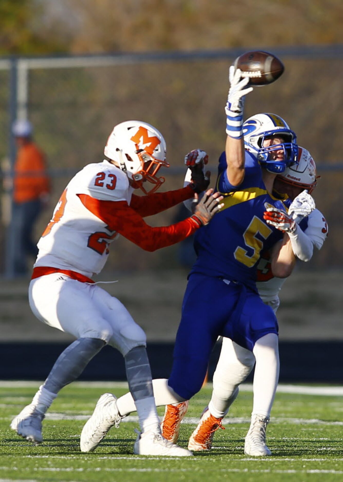 TXHSFB Sunnyvale's Cash Goodhart (5) passes down field on a flea flicker play as he is hit...