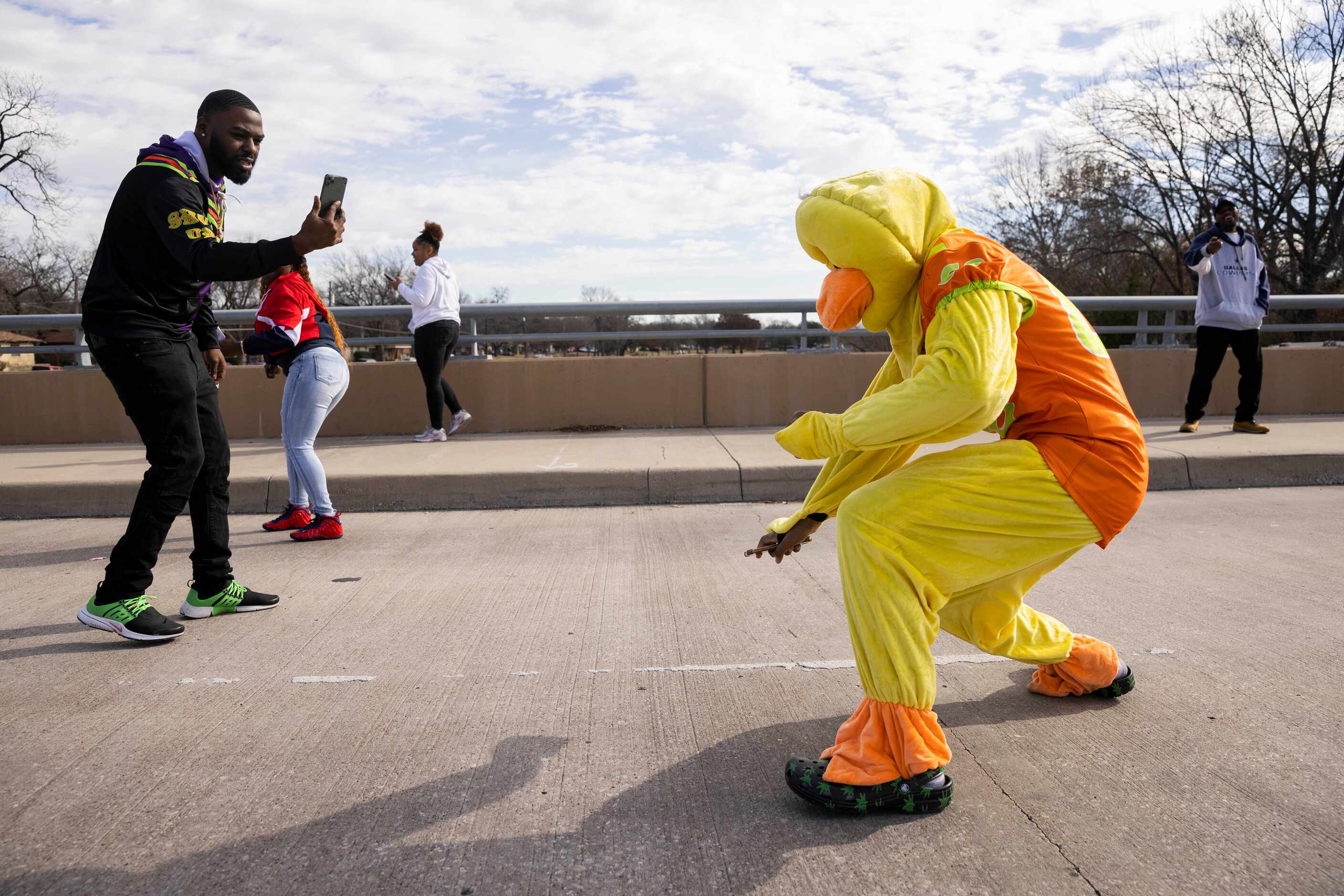 Dexter Ivory, 16, as the duck with Ducks Elite stops to dance during a parade for the South...