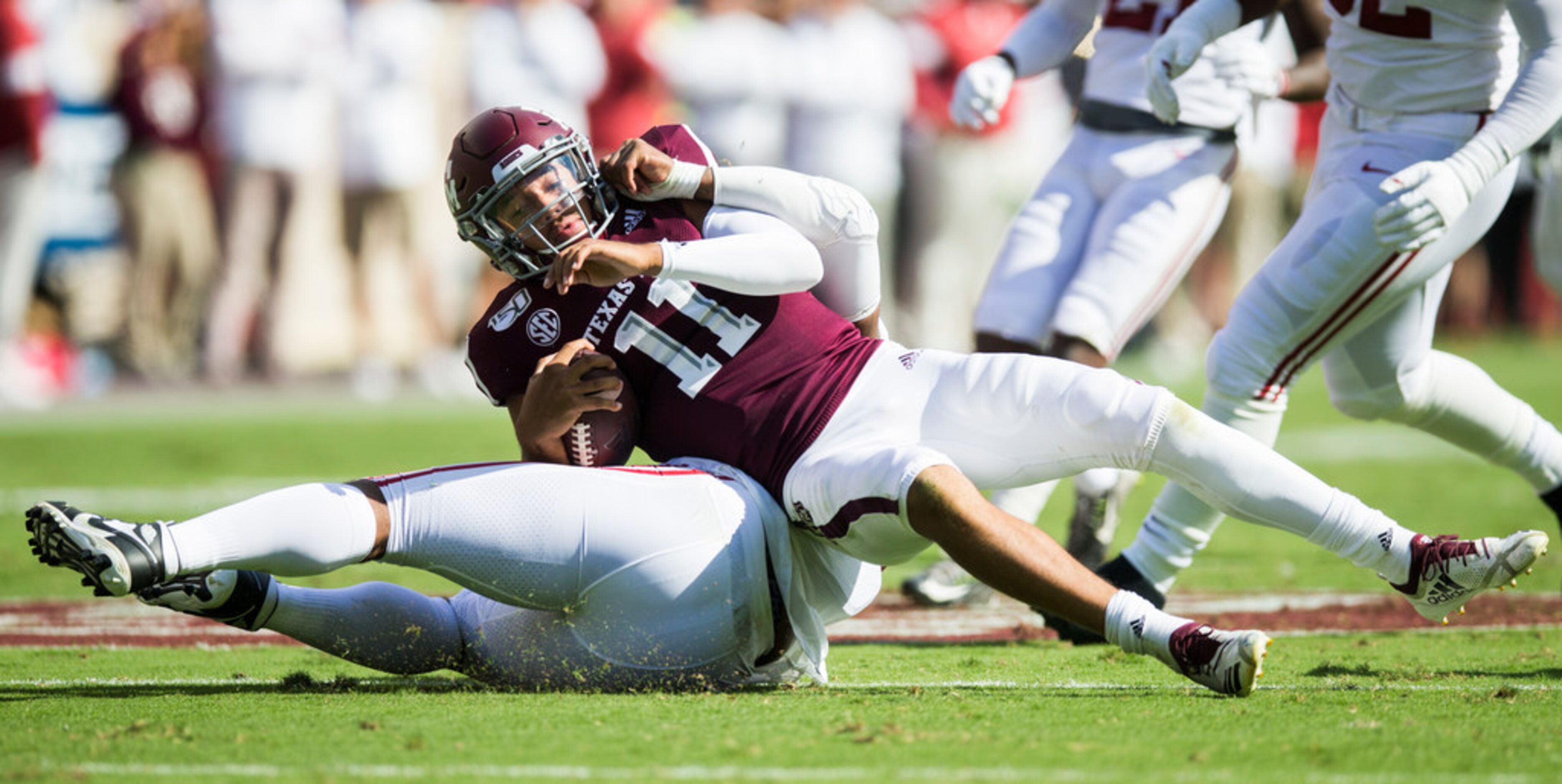 Texas A&M Aggies quarterback Kellen Mond (11) is sacked by Alabama Crimson Tide linebacker...