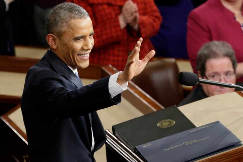  President Barack Obama waves before giving his 2015 State of the Union address before a...