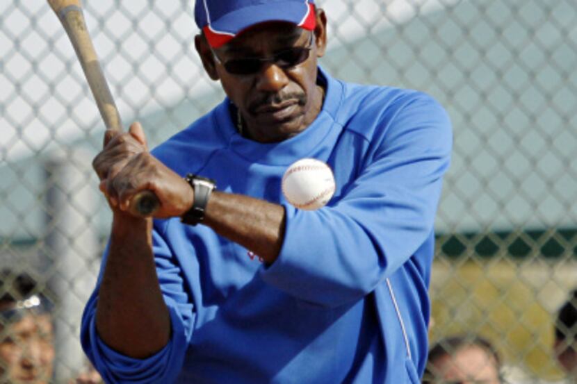 Texas Rangers manager Ron Washington hits to pitchers during spring training camp Thursday,...