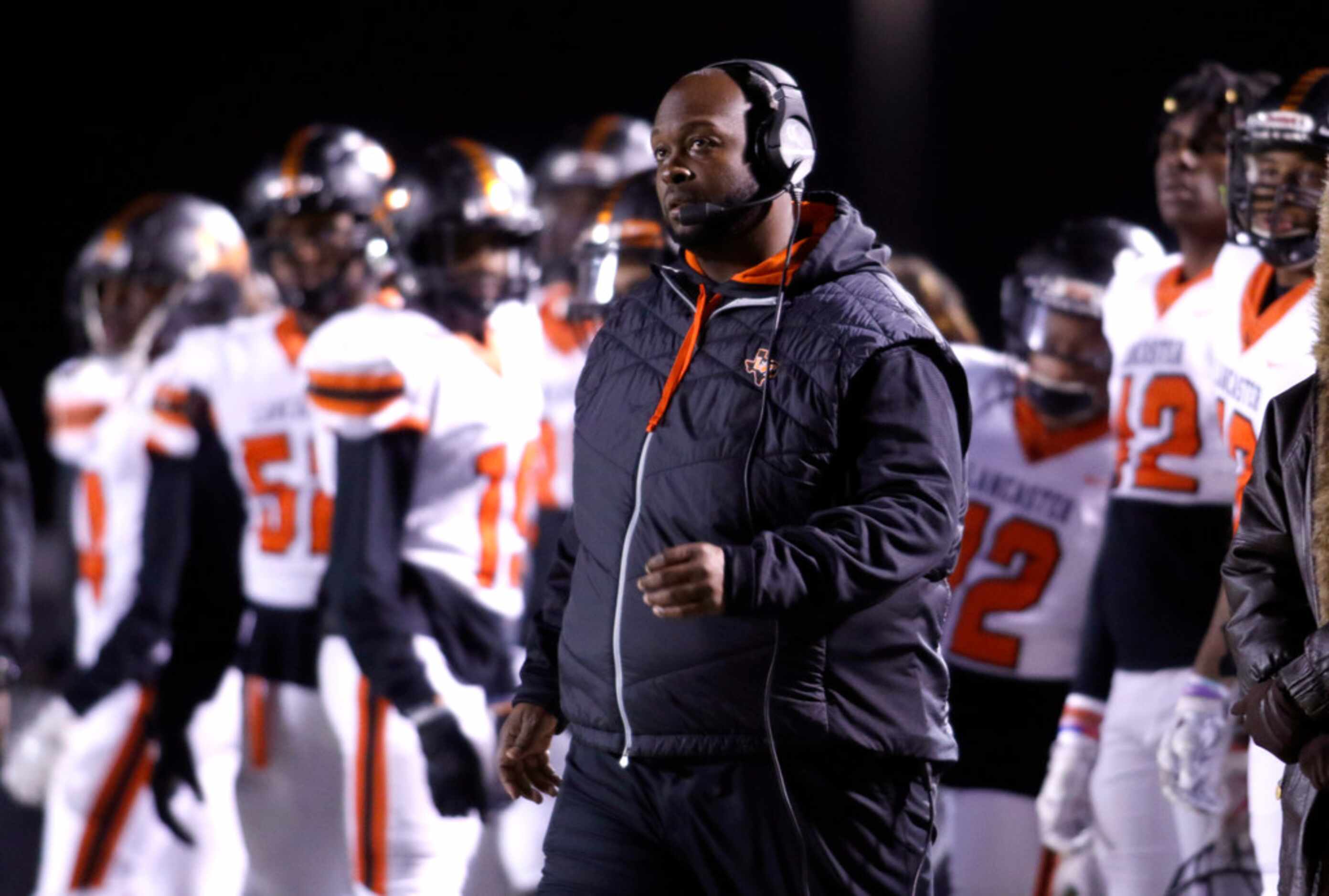 Lancaster head coach Chris Gilbert watches an extra point attempt following a first quarter...