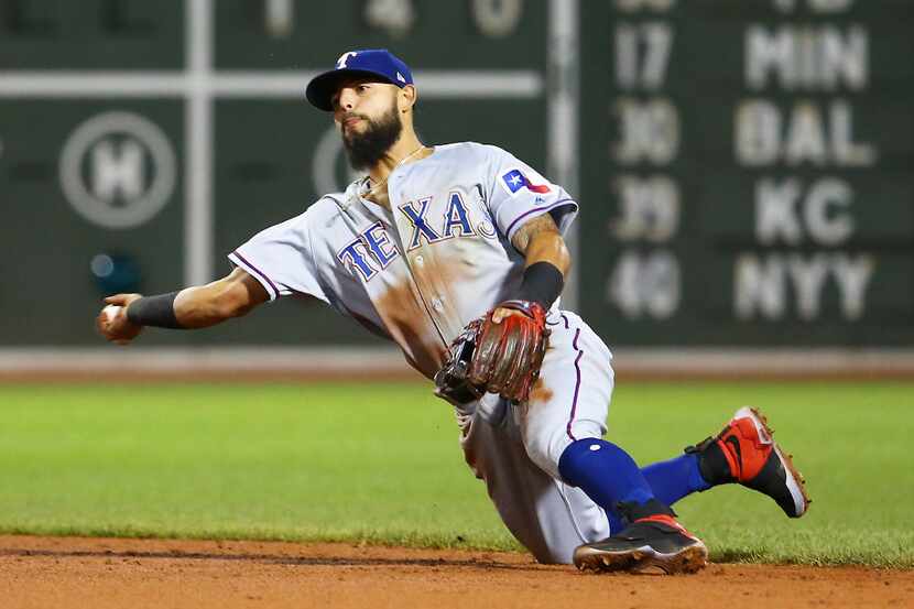 BOSTON, MA - MAY 24:  Rougned Odor #12 of the Teaxs Rangers throws to first base in the...