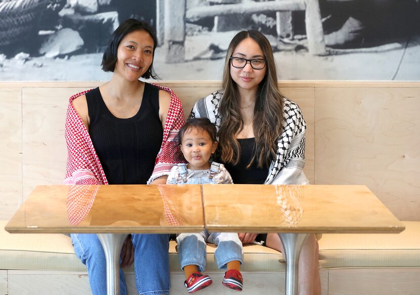 Amy Tran, left, and Stephanie Drenka, of the Dallas Asian American Historical Society, pose...