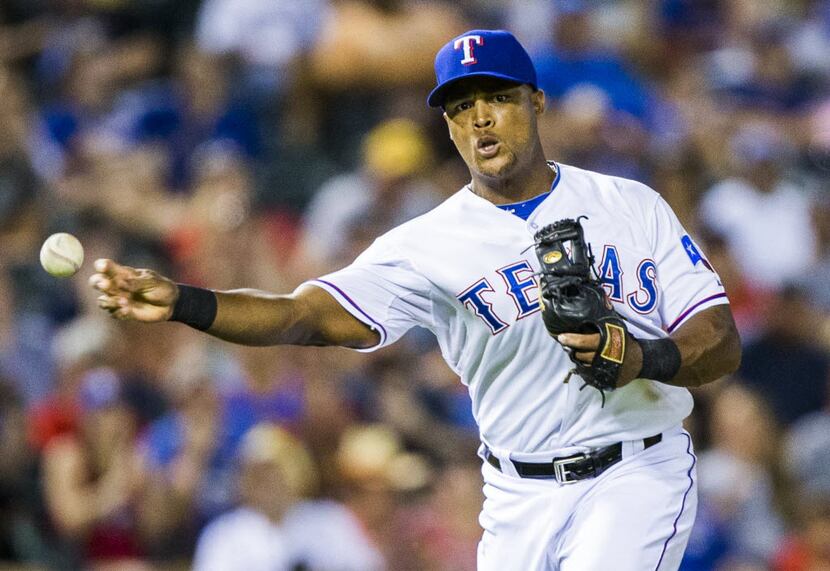Texas Rangers third baseman Adrian Beltre (29) throws to first base during the sixth inning...