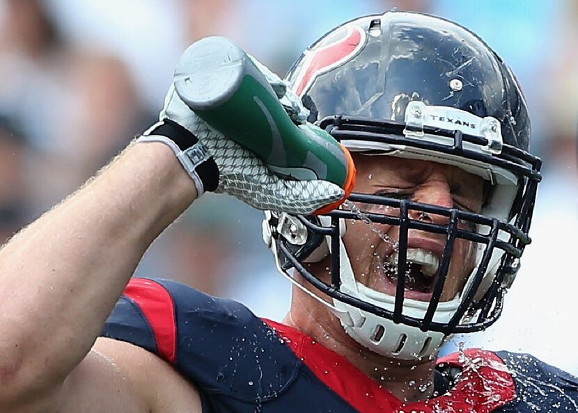 CHARLOTTE, NC - SEPTEMBER 20:   J.J. Watt #99 of the Houston Texans drinks some water in the...