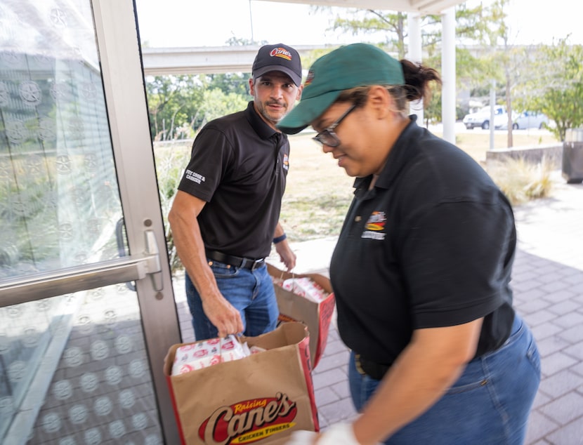 Nick Titus, area leader of Raising Cane's restaurants, and restaurant leader Channing...