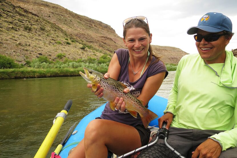 Guide Ben Magtutu makes sure his guests catch plenty of fish while drifting down the...