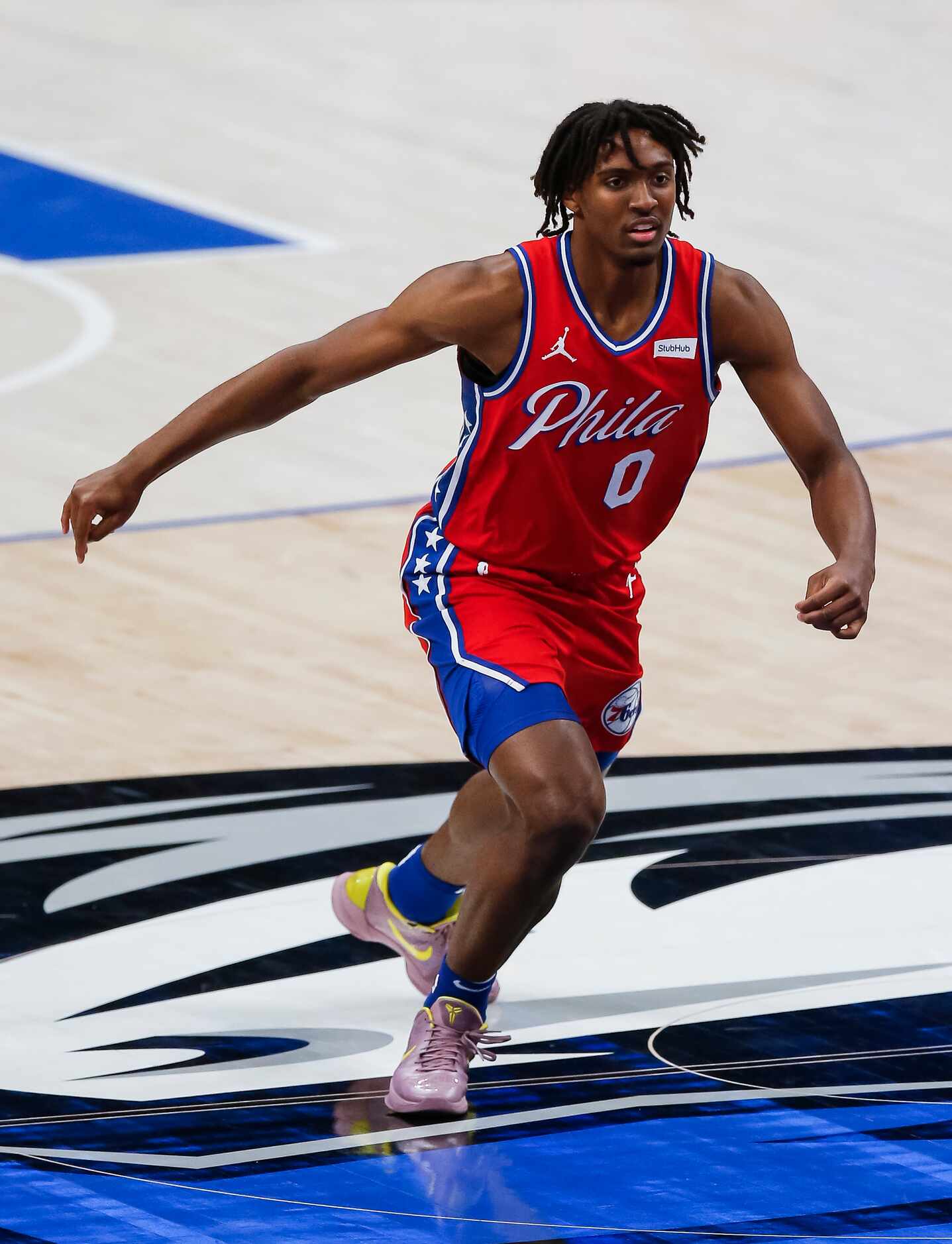 Philadelphia 76ers guard Tyrese Maxey (0) defends during the second half of an NBA...
