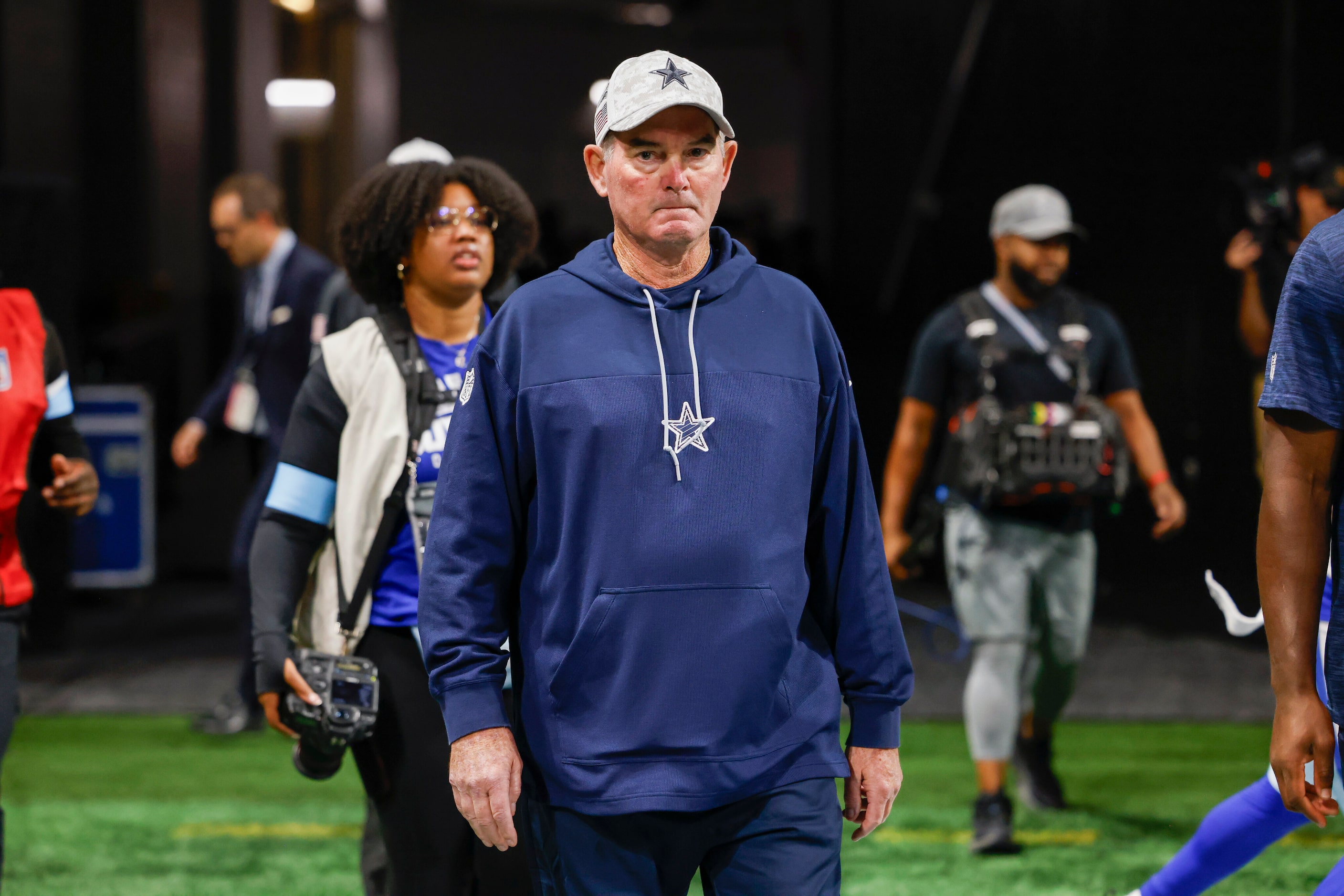 Dallas Cowboys defensive coordinator Mike Zimmer walks onto the field before a game against...