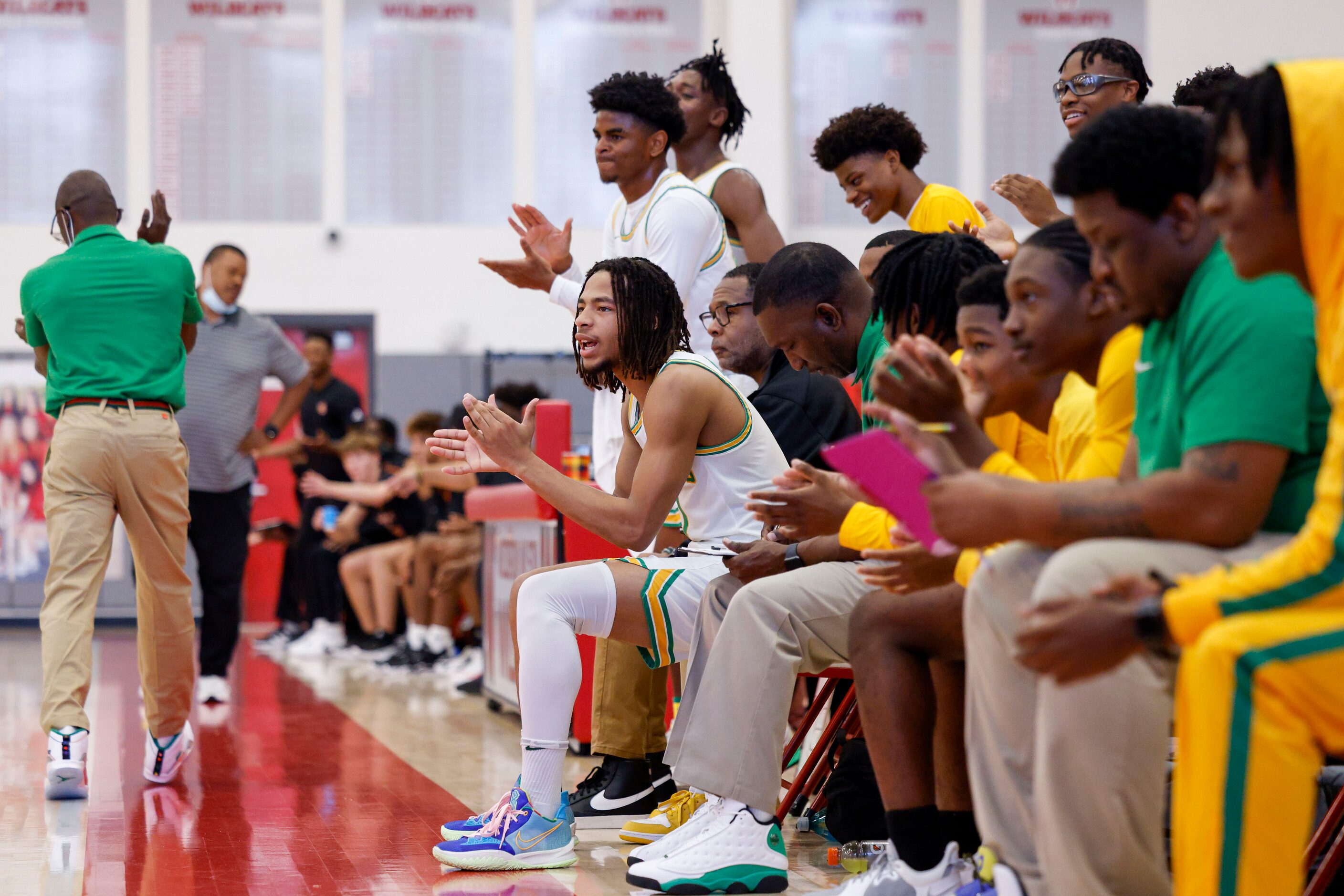 Madison players celebrate a play during the second quarter of a Dallas ISD Holiday...