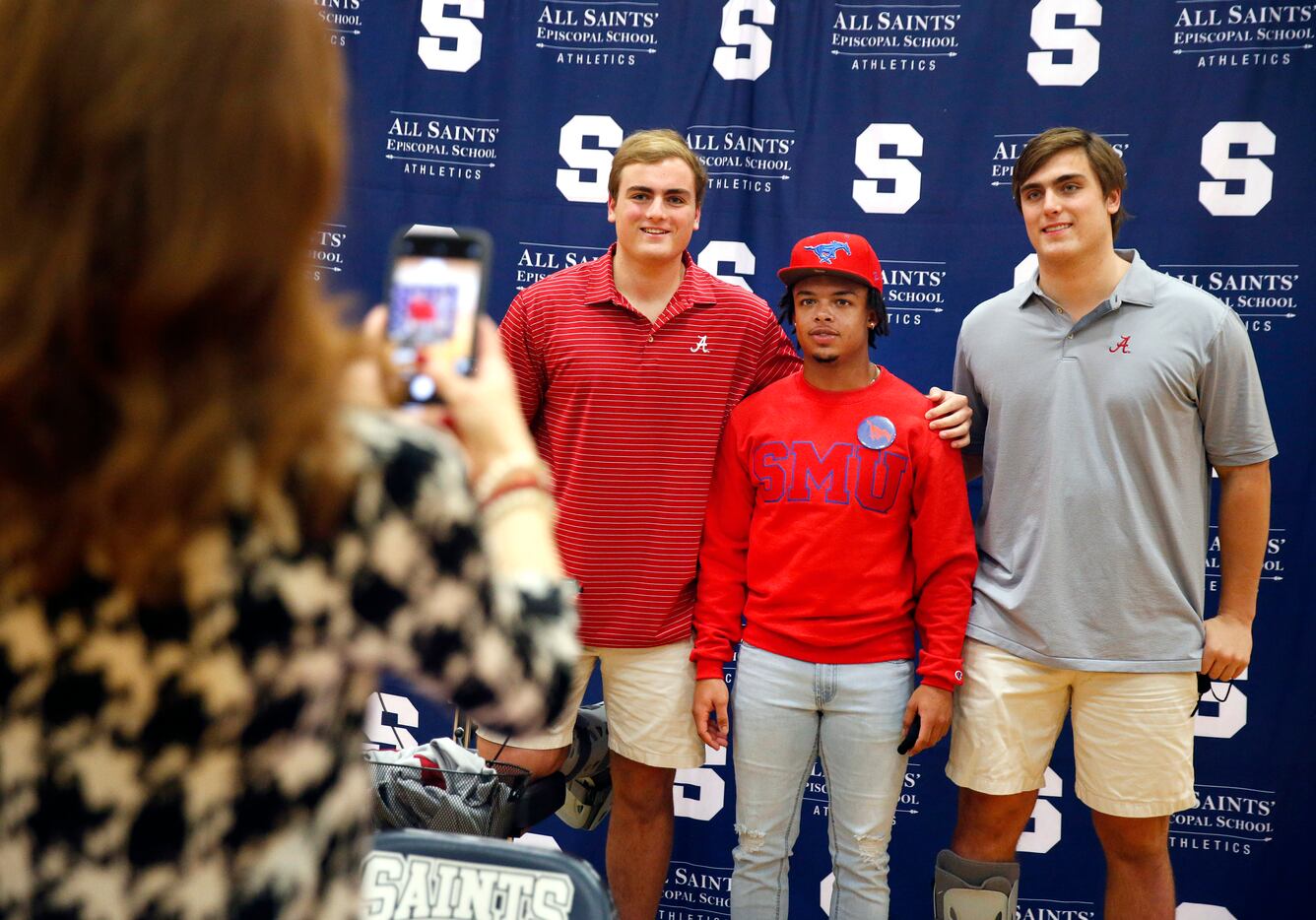 Fort Worth All Saints' Episcopal School offensive lineman Tommy Brockermeyer (right) and his...