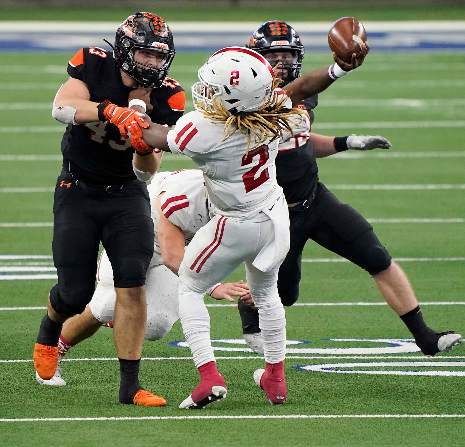 Crosby Deniquez Dunn (2) tries to pass under pressure from Aledo defensive lineman Kyle...