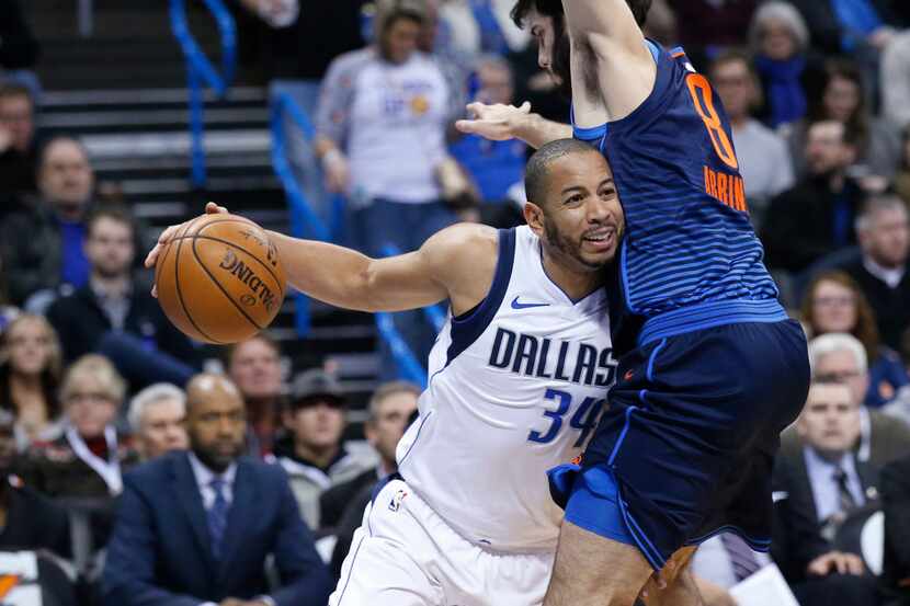 Dallas Mavericks guard Devin Harris (34) drives against Oklahoma City Thunder guard Alex...