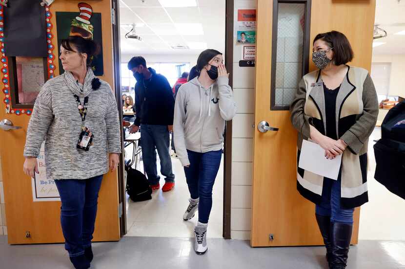 Eighth grade student Sydney Kasprowicz quickly whispers to Terrell ISD Superintendent...