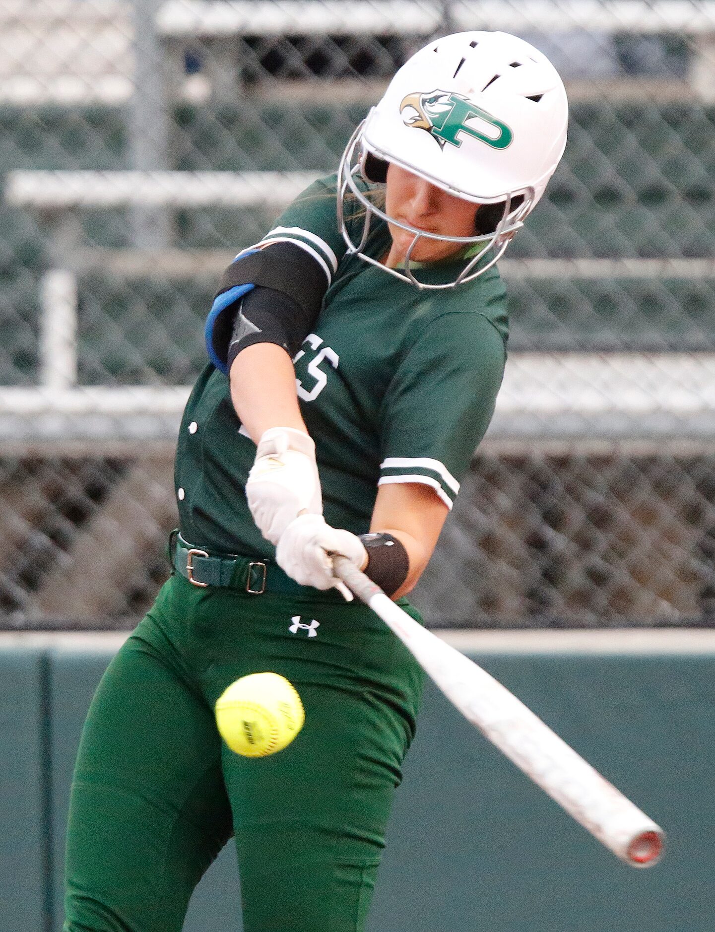 Prosper High School catcher Gabby Coffey (10) gets a hit in the first inning as Prosper High...