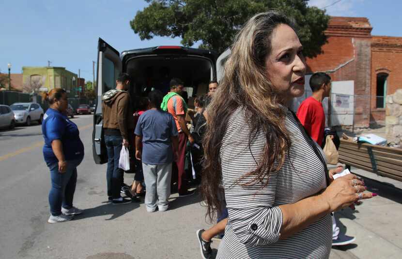 María Isabel Pineda, an El Paso resident, brought pizzas to migrants recently released by...