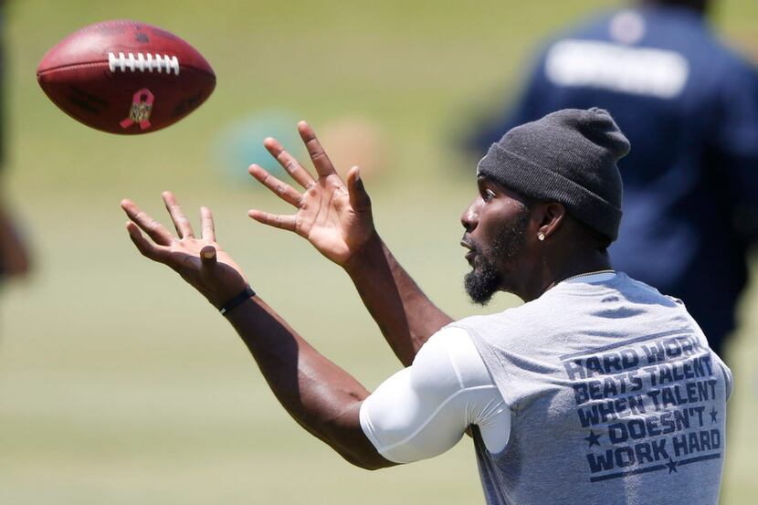 Dallas Cowboys wide receiver Dez Bryant prepares to catch the ball during rookie minicamp at...