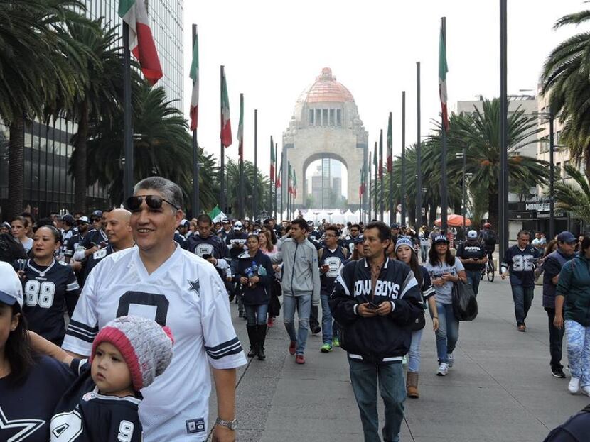 Cowboys fans walked for a mile from Monumento de la Revoluci n, a Mexico City landmark, to a...