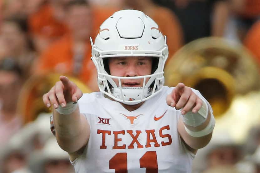 FILE - Texas quarterback Sam Ehlinger (11) is pictured during the Red River Showdown against...
