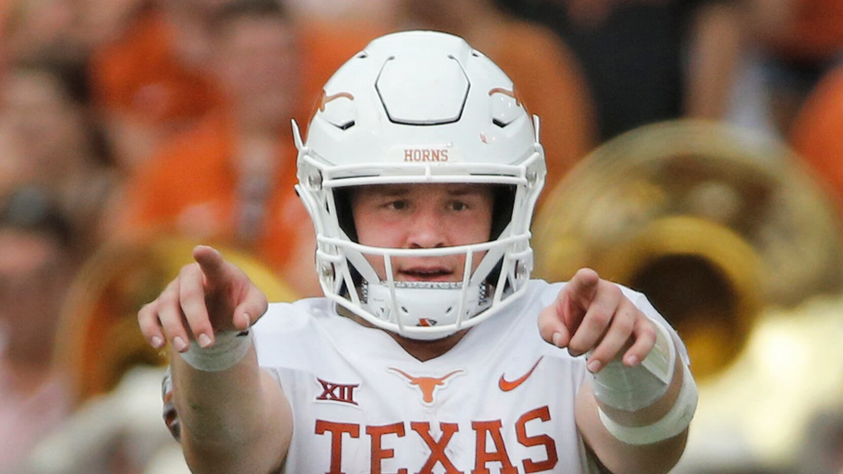 FILE - Texas quarterback Sam Ehlinger (11) is pictured during the Red River Showdown against...