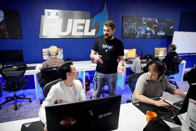 Ashley "Trill" Powell, left, speaks to Dallas Fuel general manager Mat Taylor, center, while...