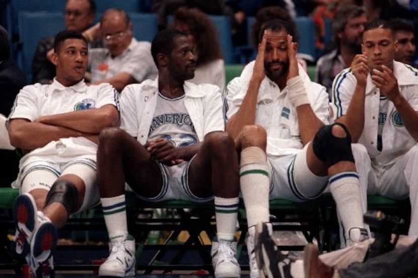 Dallas Mavericks player, from left, Randy White (33), Herb Williams (32), James Donaldson...