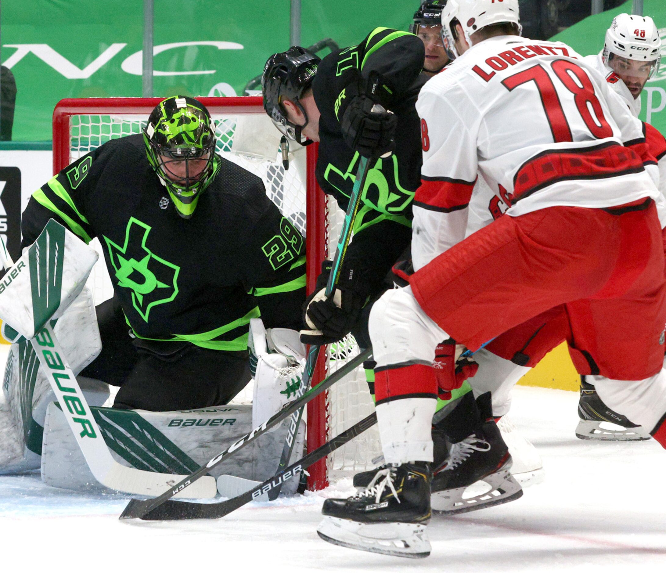 Dallas Stars goaltender Jake Oettinger (29) and defenseman Mark Pysyk (13) defend against...