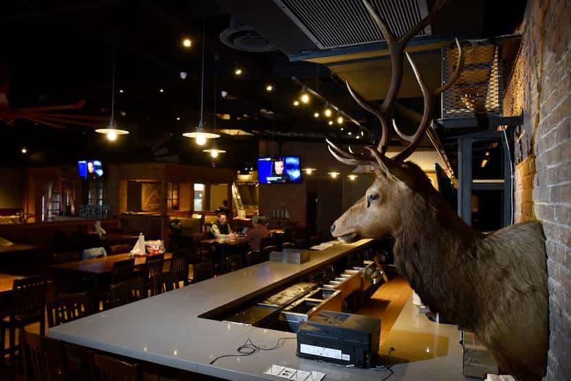 Deer heads decorate the bar area inside the new Tender Smokehouse in Frisco.