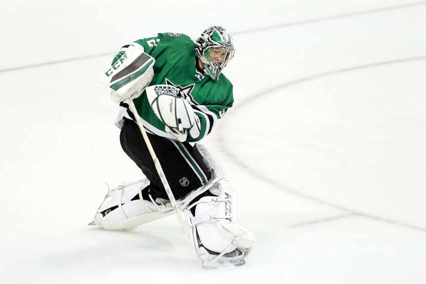 Dallas Stars goalie Kari Lehtonen (32) clears the puck against the St. Louis Blues during...