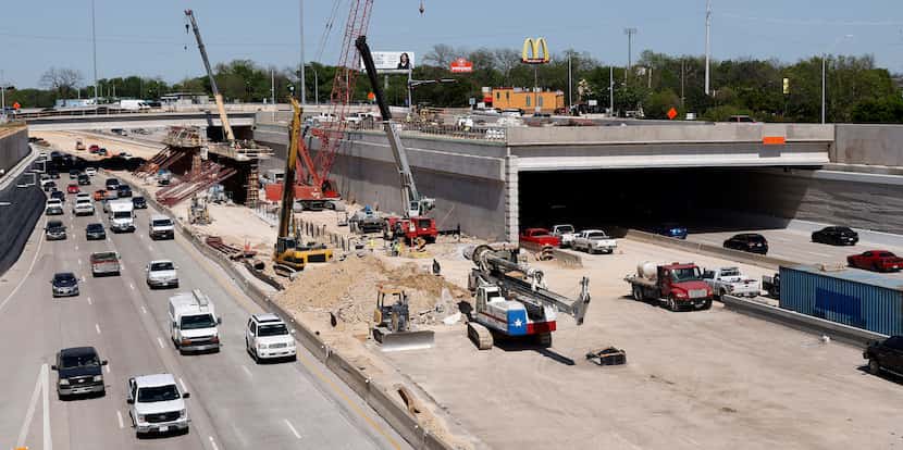The Southern Gateway deck park is under construction across I-35E between Ewing and Marsalis...