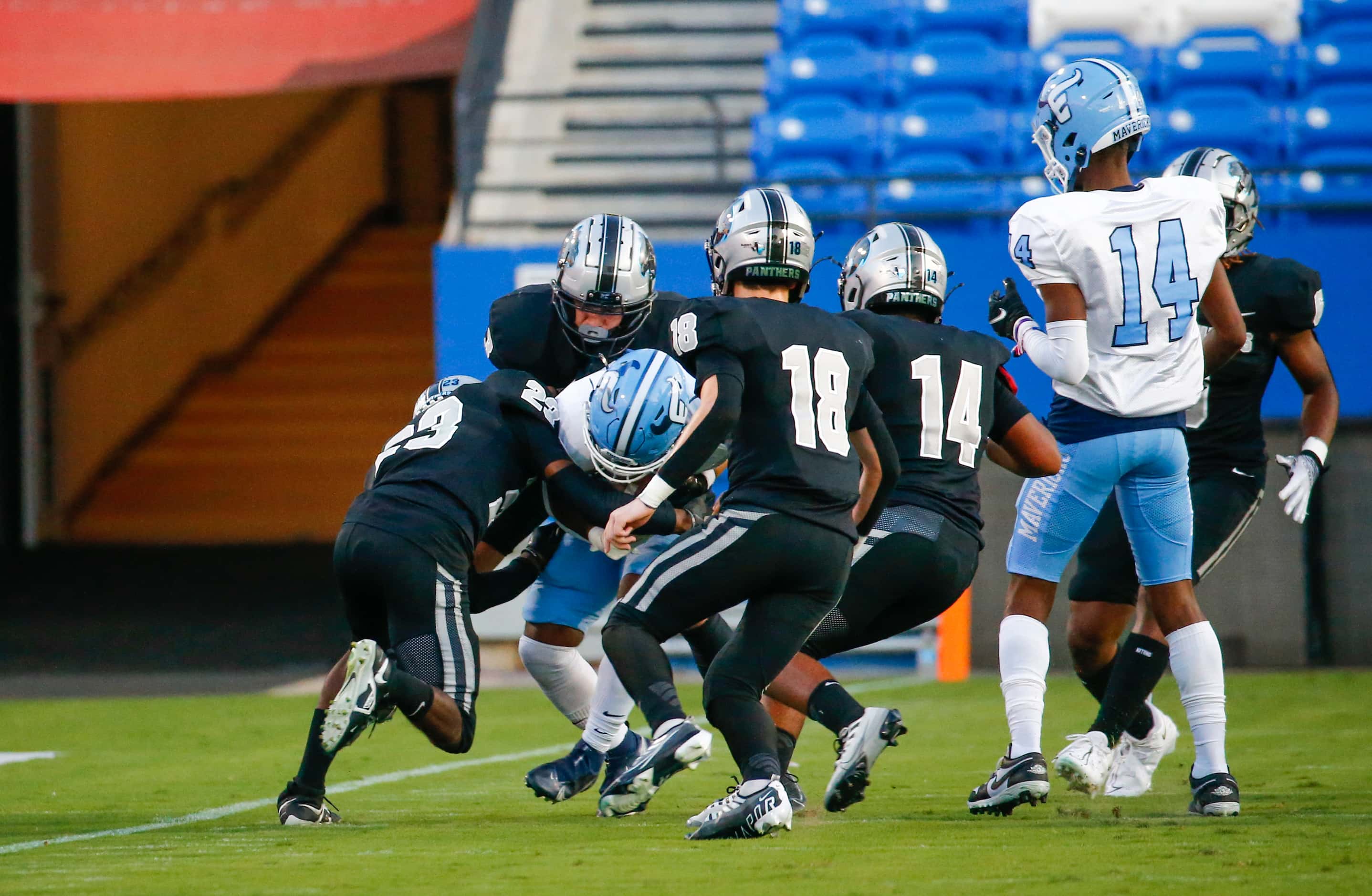 Panther Creek Panthers defense group up to block the Emerson Mavericks from moving the ball...