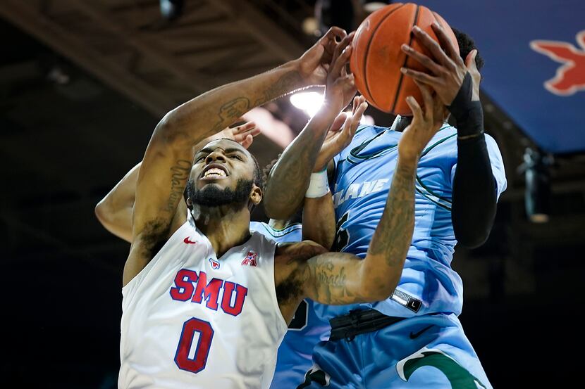 SMU guard Tyson Jolly (0) fights for a rebound against Tulane guard Teshaun Hightower (5)...