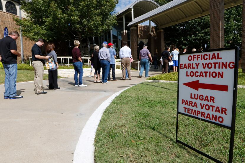 Voters waited to vote early at Our Redeemer Lutheran Church in Dallas on Monday, October 24,...