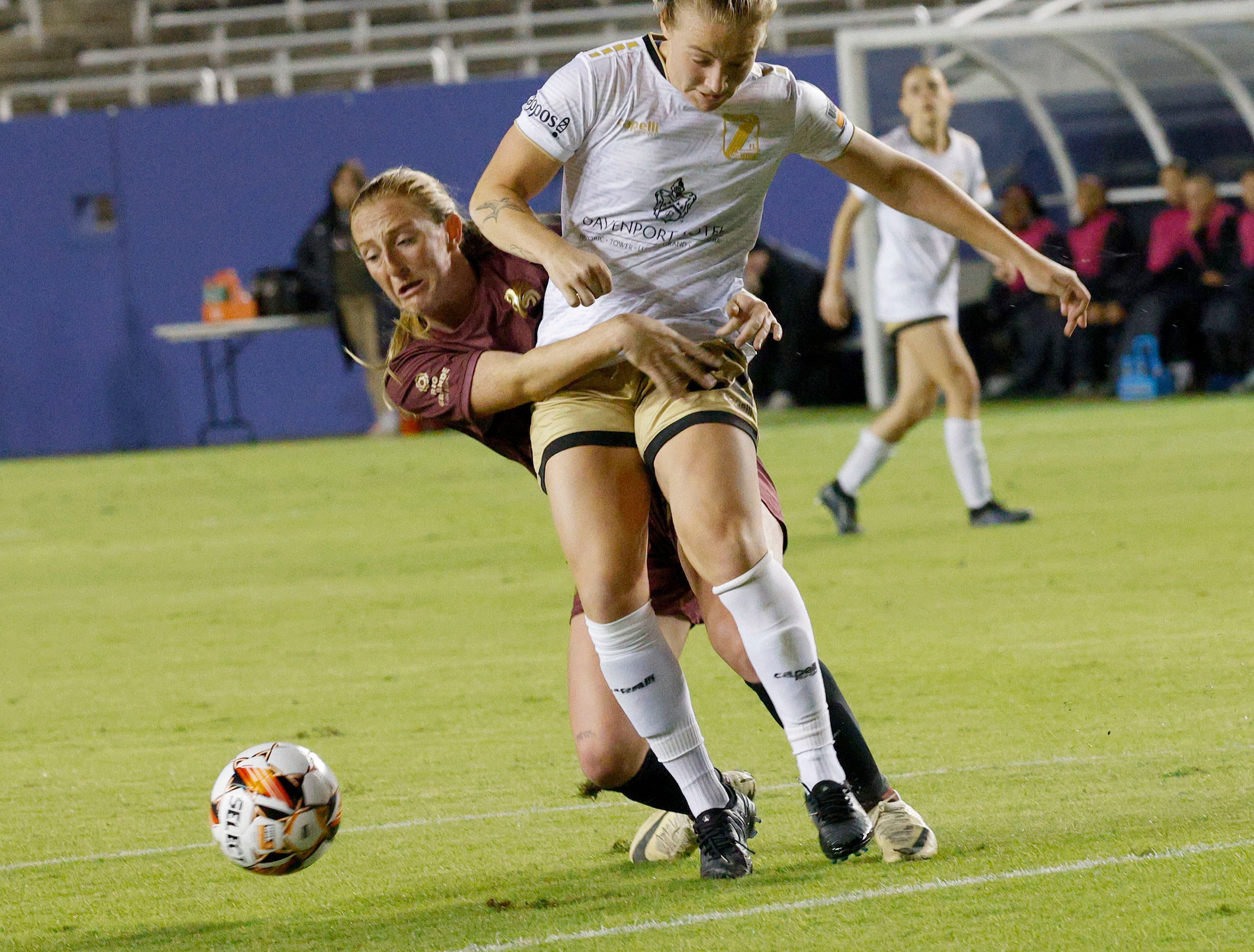 Dallas Trinity forward Rachel McCarthy (33) tries to stop Spokane Zephyr defender Julianne...