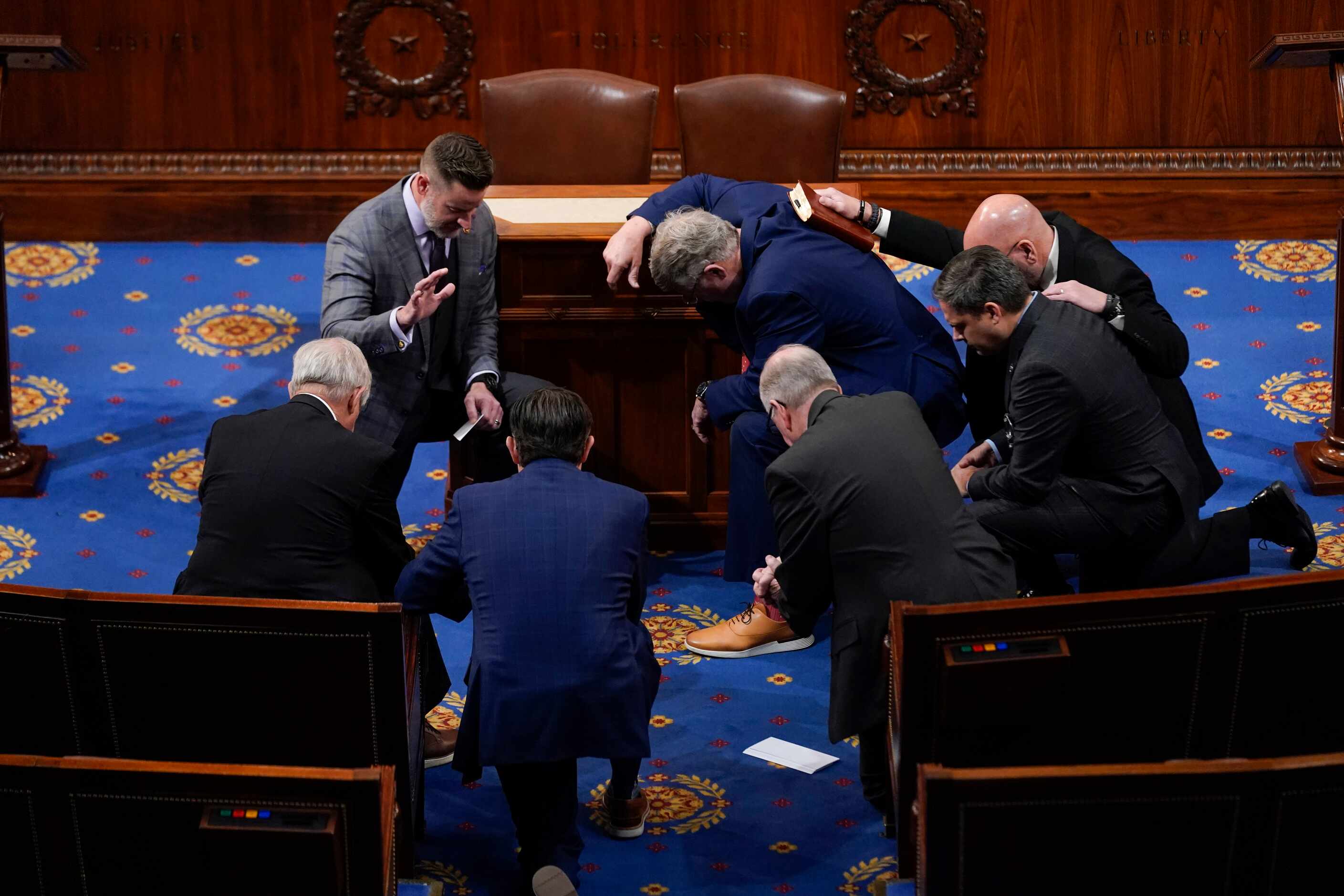 Members of Congress prayer in the House chamber before the House meets for the fourth day to...