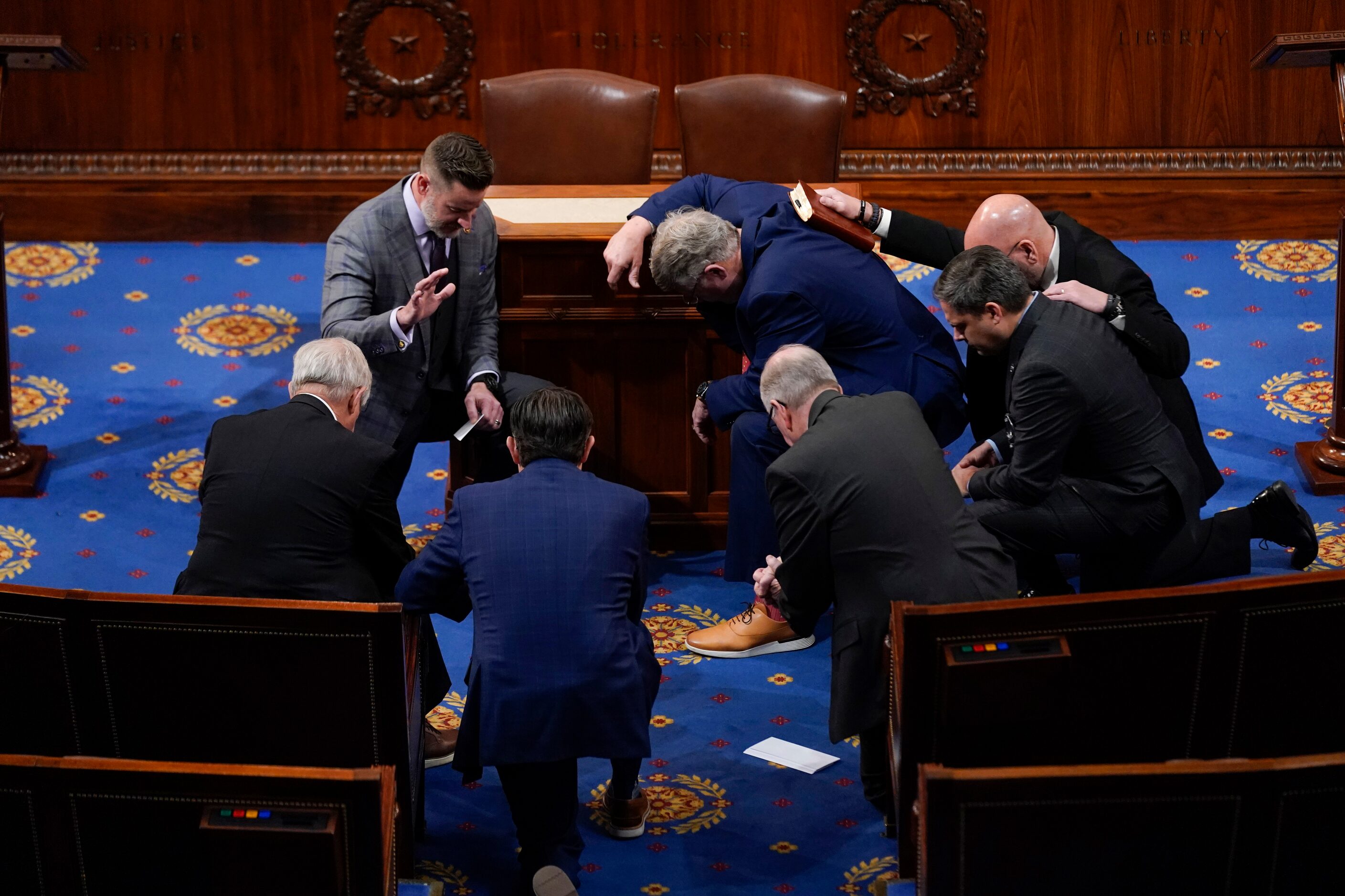 Members of Congress prayer in the House chamber before the House meets for the fourth day to...