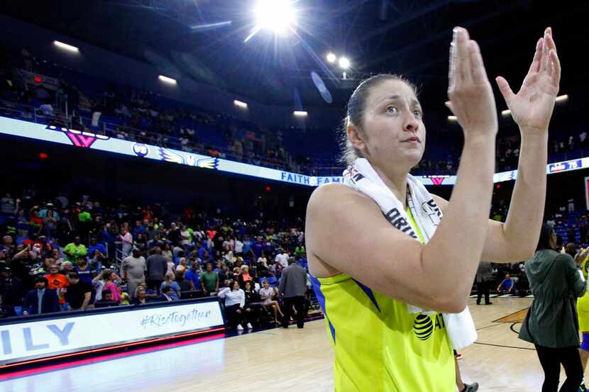 Dallas Wings center Theresa Plaisance (55) acknowledges the support of Wings fans in...