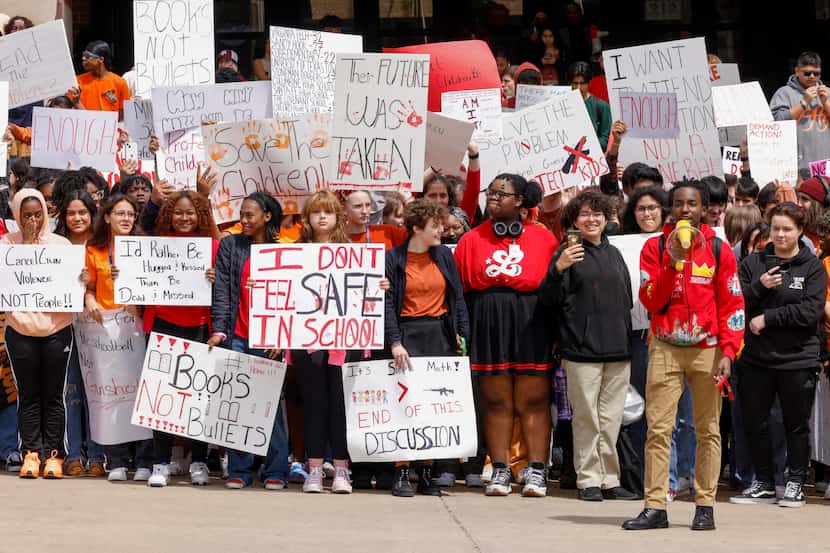 Students chant and carry signs calling for gun reform during a walkout at Townview Magnet...