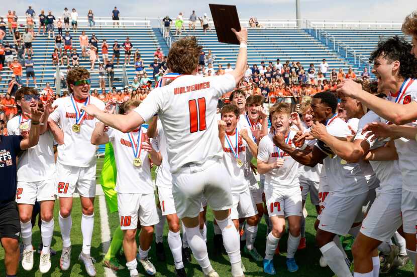 Frisco Wakeland forward William Heidman (11) celebrates with his teammates after being named...