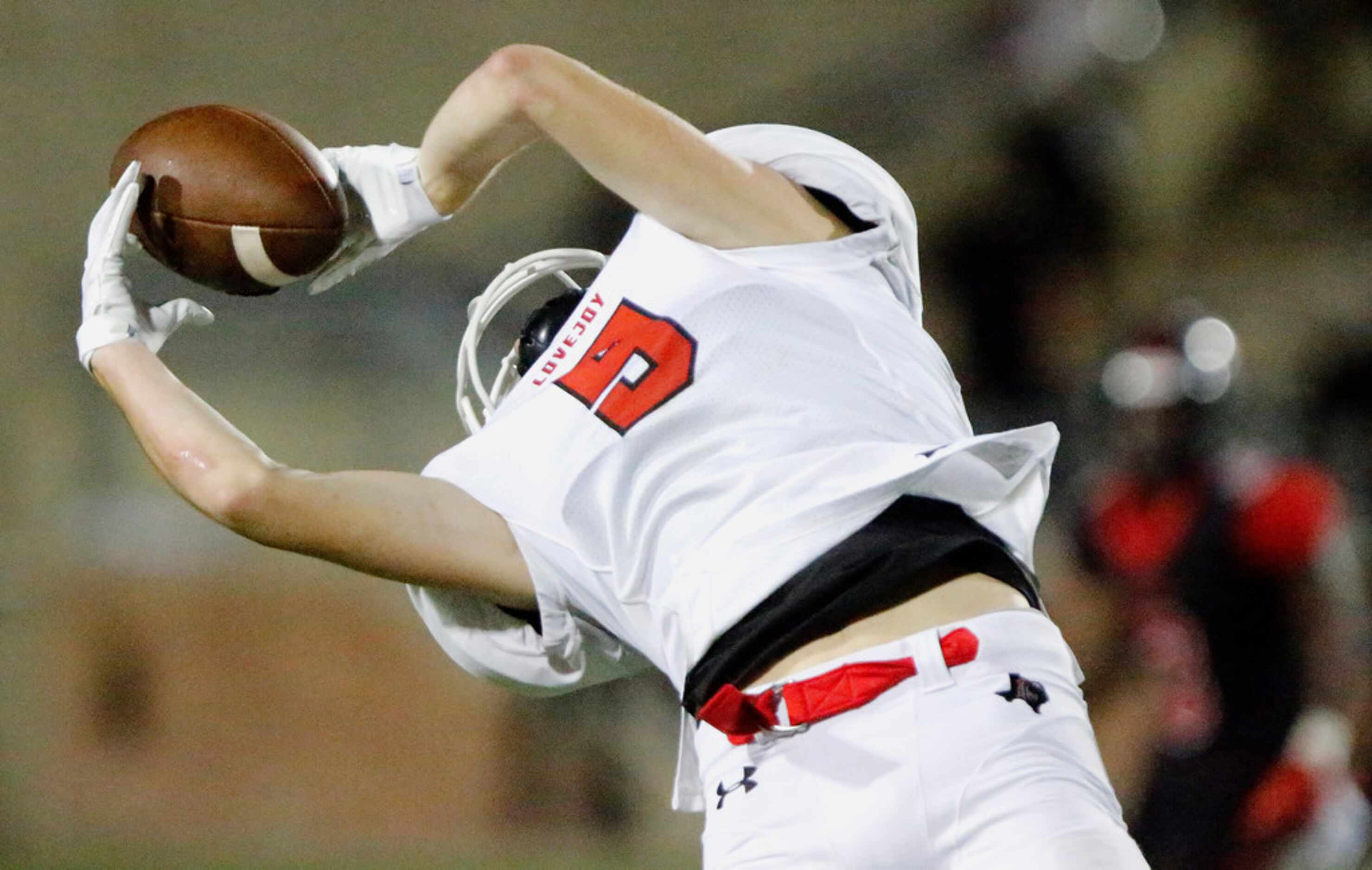 Lovejoy High School wide receiver Reid Westervelt (9) makes a juggling catch during the...