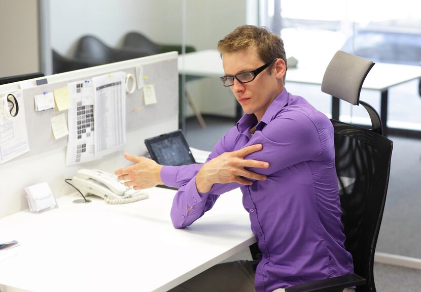 Try gentle stretches while at work.