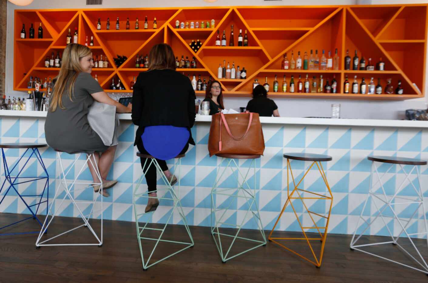 Taylor Gainan, left, and  Elise Lynott, conduct business at the Halcyon Coffee Bar and...