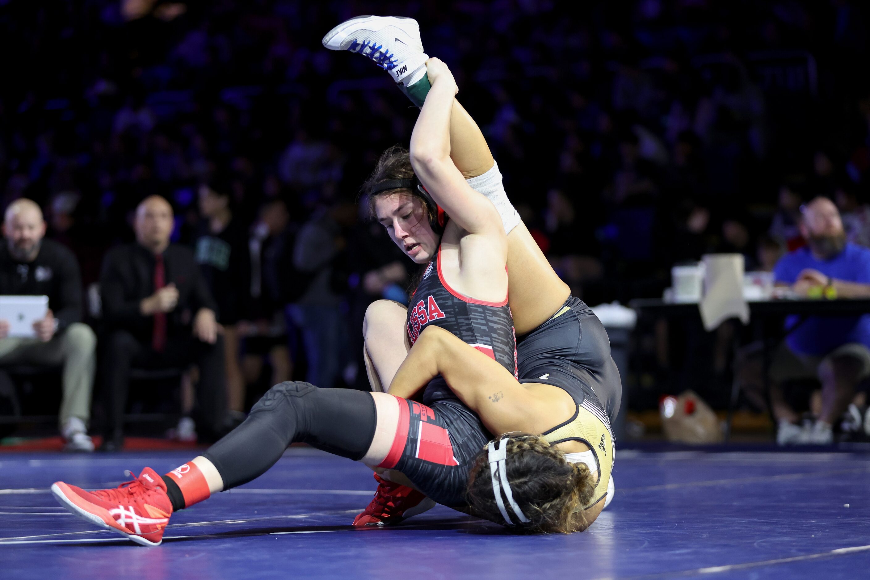 Akeelah Moore of Melissa (red) competes against Madison Pena of Lubbock in the Girls 5A...