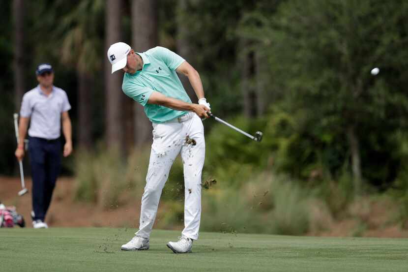 Jordan Spieth hits from the 10th fairway during the third round of the Players Championship...