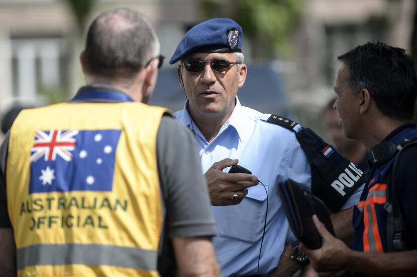 Members of the Dutch and Australian forensic investigating teams meet Monday in Donetsk,...