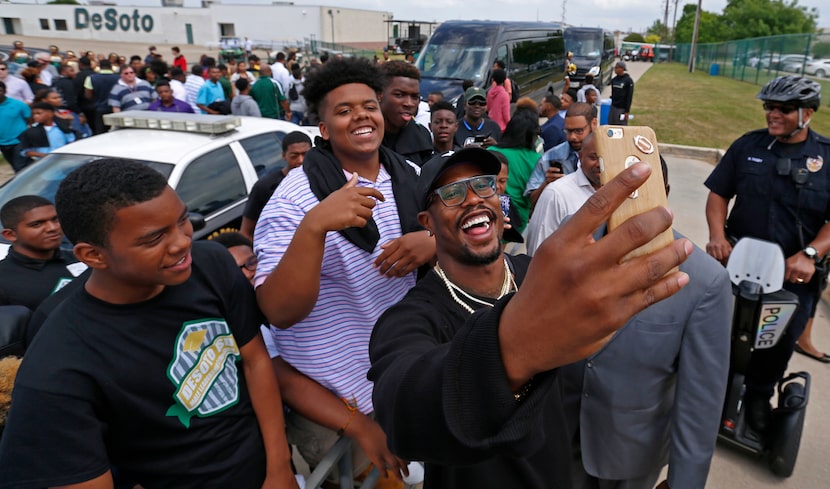 Denver Broncos linebacker Von Miller takes a selfie with fans during Von Miller Day at...