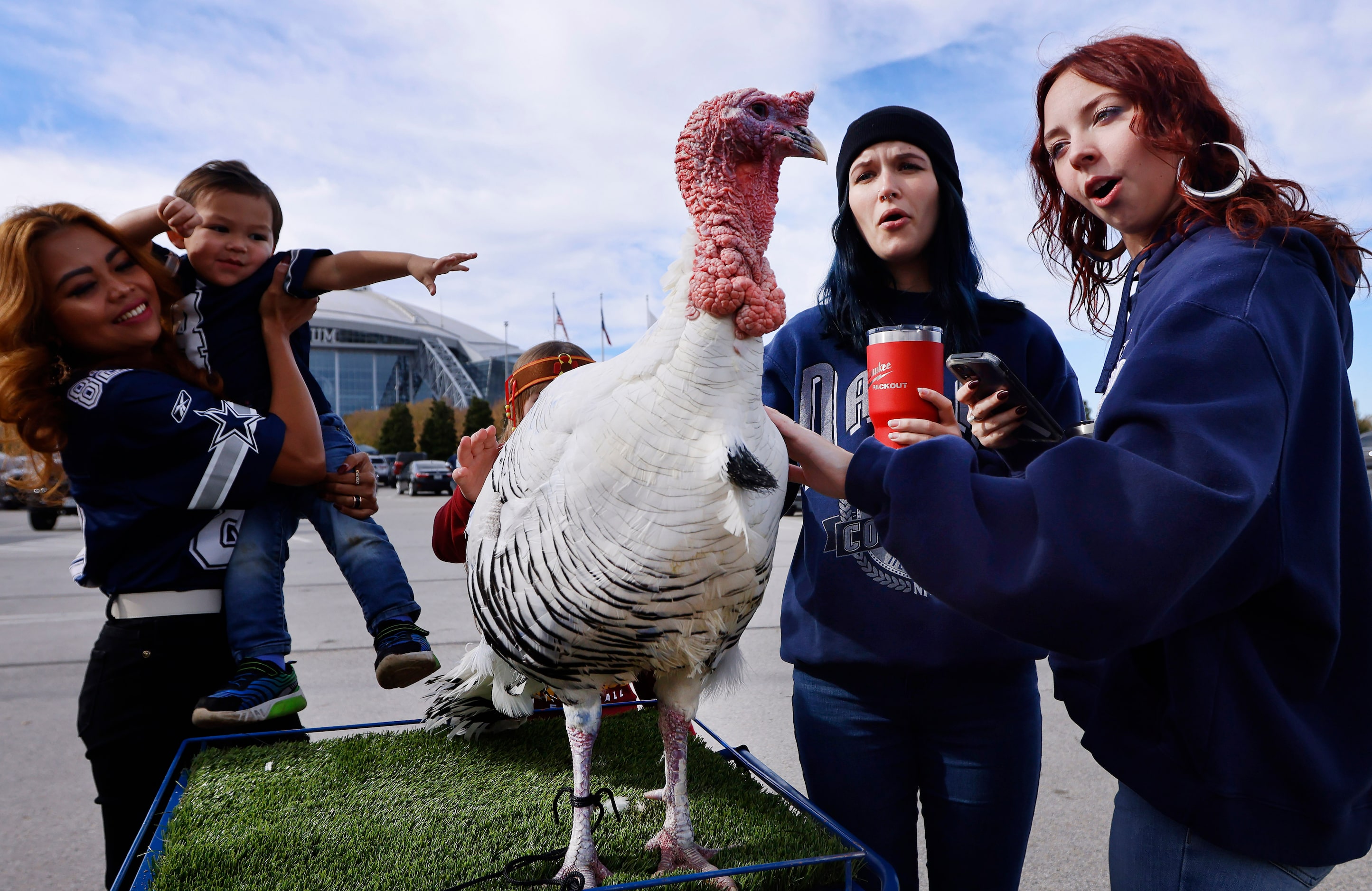 Dallas Cowboys fans and friends Zoe Snyder (right) and Chloe Cramer (second from right) of...